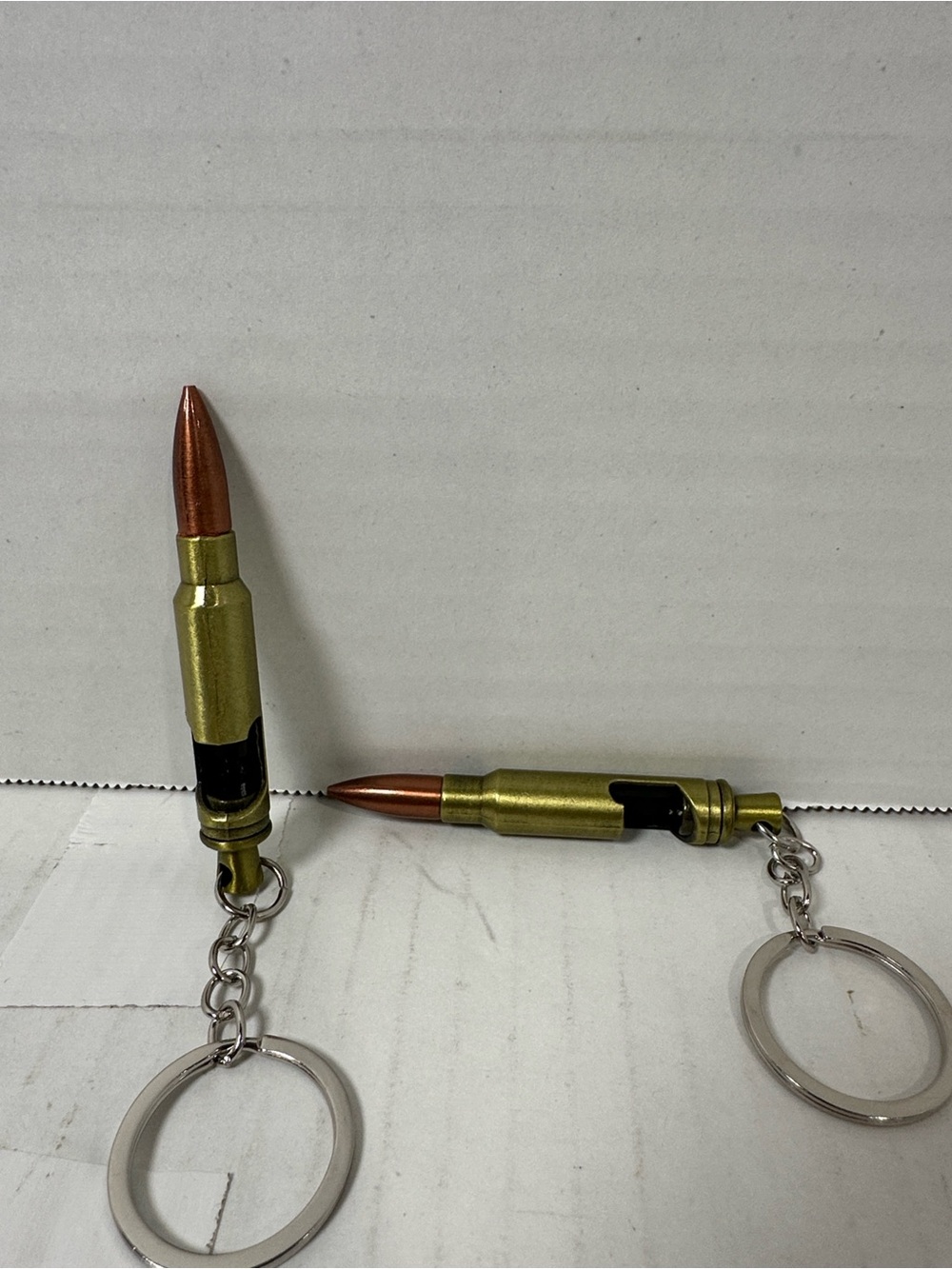Brass and copper bottle opener key chain.